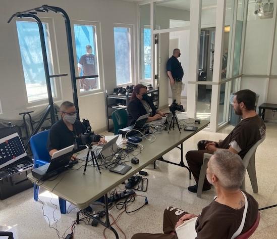 Department of Revenue employees set up a identification kiosk in Pueblo County Jail.