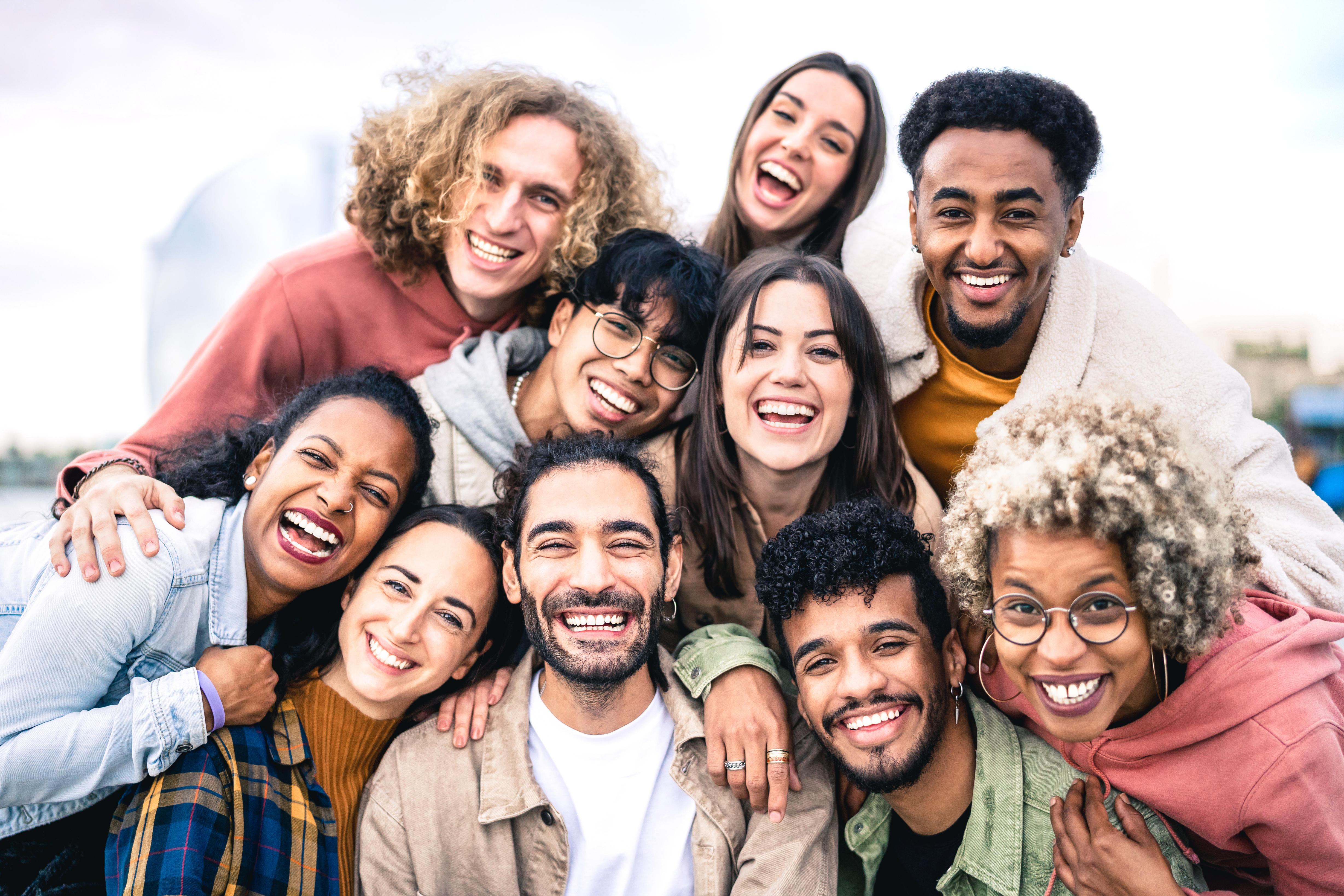Image description: A diverse group of people smiling